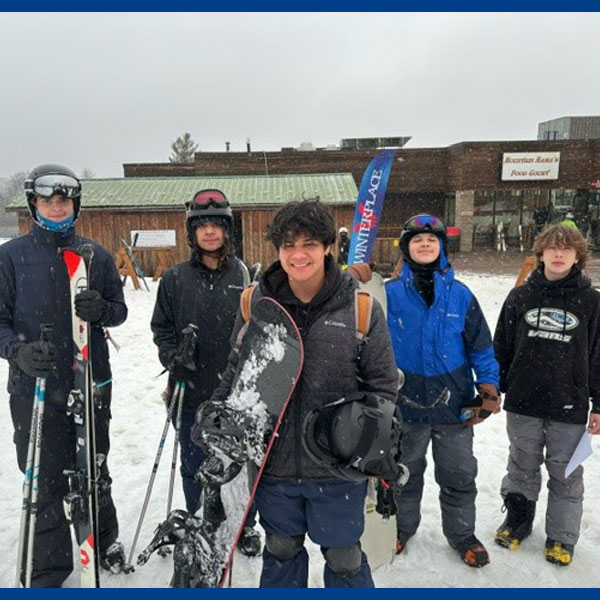 Group of Scouts with skis and snowboards at Winterplace
