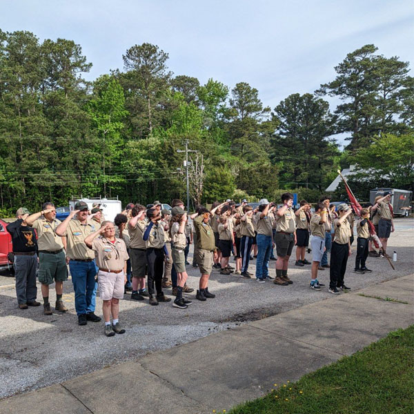 Scouts saluting at Princess Anne District Camporee in April 2023.