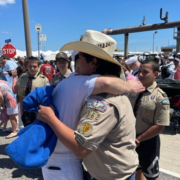 Commander Roberson and Jacob embrace