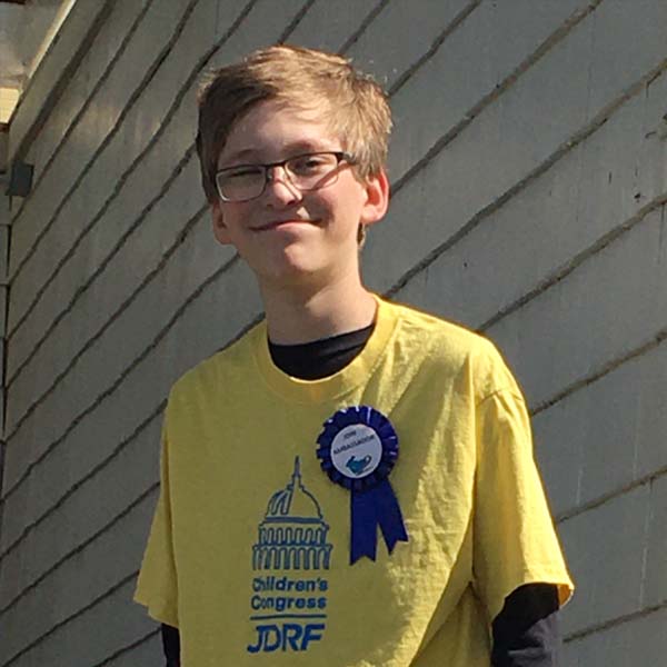 Photograph of Jack wearing Children's Congress t-shirt