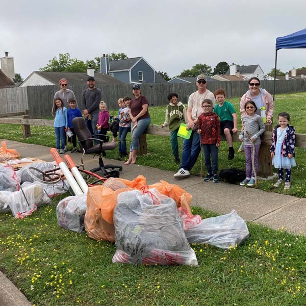 Cub Scout families in park following trash clean-up