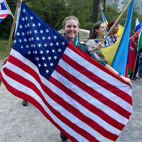 Laura Bussiere holding the American flag at Kander 100