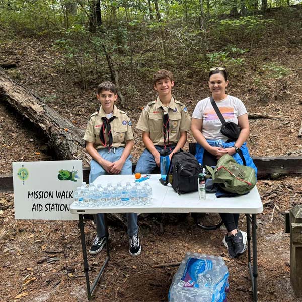 Scouts from Troop 362 staffing a water station during the 2023 Father Savas Constantinou Memorial Family Mission Walk