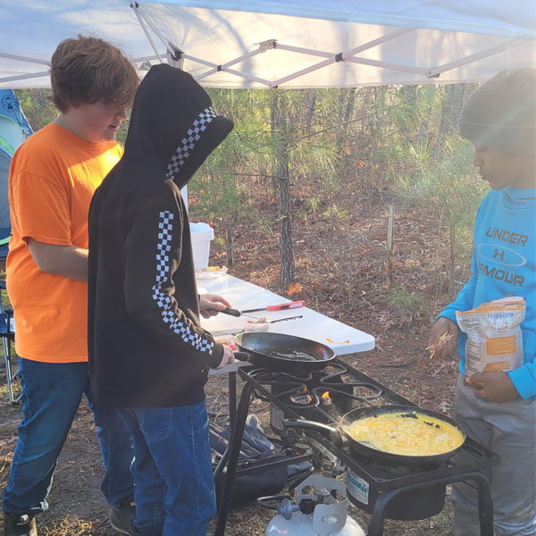 Scouts cooking at the 2024 Albemarle Freezoree in Barco, NC