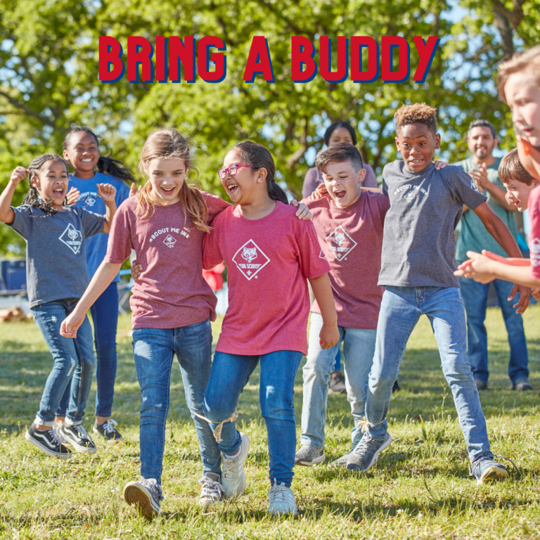 Bring a Buddy Scouts participating in a three-legged race