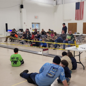 Scouts and families watching the 2024 Albemarle District Pinewood Derby