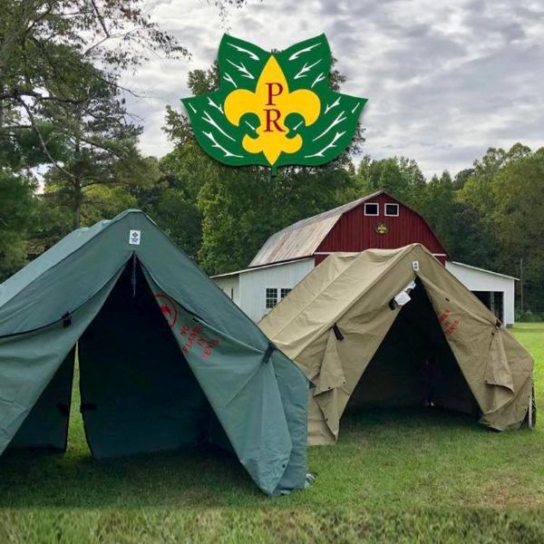 Photo of two tents at Pipsico Scout Reservation in front of the barn