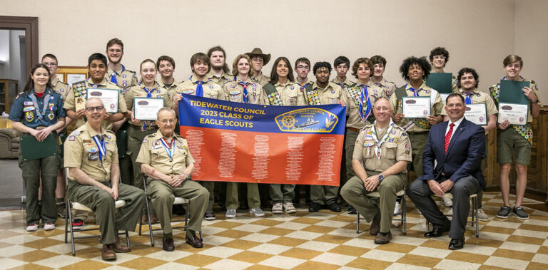 Members of the 2023 Class of Eagle Scouts with Council President John Scheib, Keynote Speaker and DESA recipient Channing Zucker, Council Commissioner Tim Briggs, and Scout Executive James Parnell