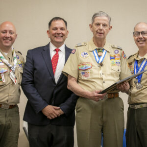 Photo of Council Commissioner Tim Briggs, Scout Executive James Parnell, Living Legend of Tidewater Council Larry Ritter, and Council President John Scheib