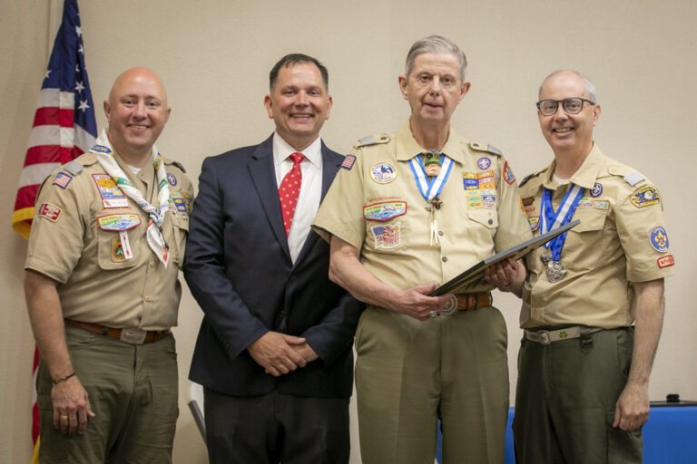 Photo of Council Commissioner Tim Briggs, Scout Executive James Parnell, Living Legend of Tidewater Council Larry Ritter, and Council President John Scheib
