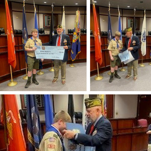 Blake R, a Second Class Scout from Troop 57, being awarded the Patriot's Pen from VFW Post 2894