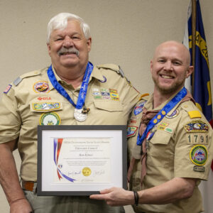 Photo of Ron Kilmer being presented the NESA Outstanding Eagle Scout Award (NOESA) by Justin Kilmer, his son and fellow NOESA recipient