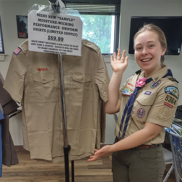 New Scout Shop staff member Katy with new trial BSA uniform shirts