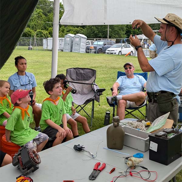 Scouts learning about refrigeration coils at Princess Anne Day Camp
