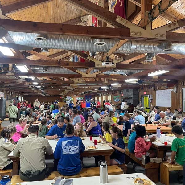 Families in the dining hall at 2024 Summer Cub Scout Camp at Pipsico Scout Reservation