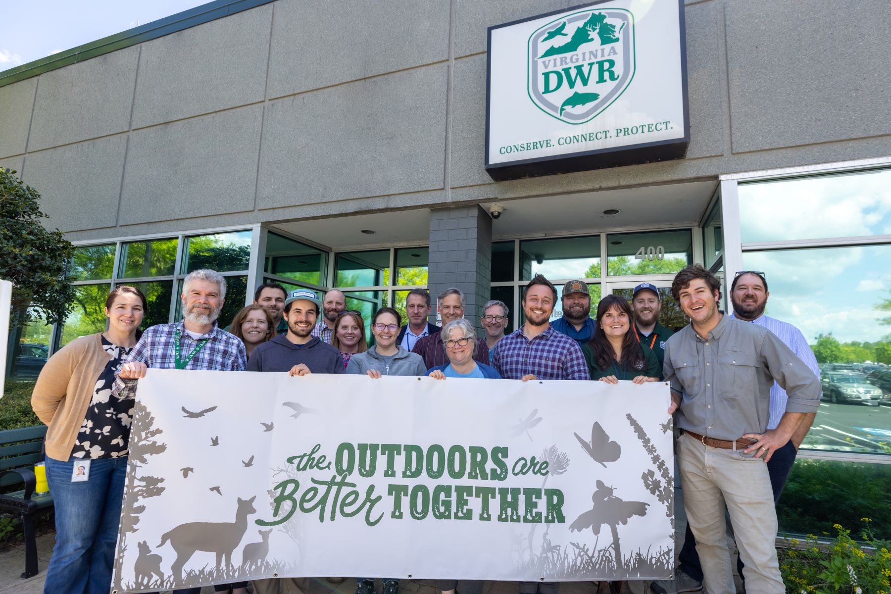 Group photo of Virginia Wildlife Grant Program recipients at Virginia DWR. The outdoors are better together. Conserve. Connect. Protect.