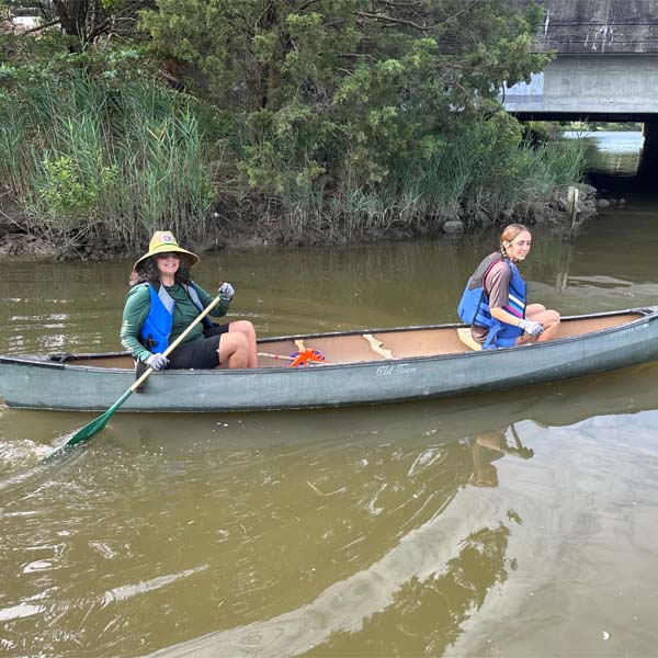 Scouts canoeing during a waterway cleanup in Virginia Beach