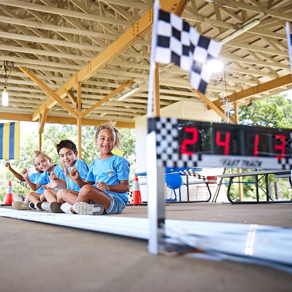 Cub Scouts cheering at a Pinewood Derby