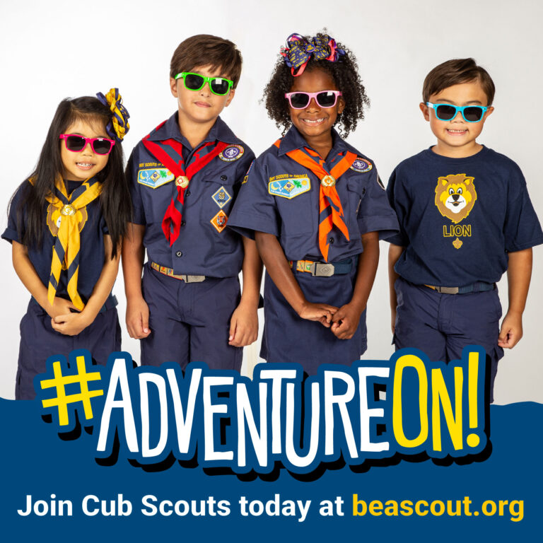 Cub Scouts in uniforms and sunglasses. Adventure On!